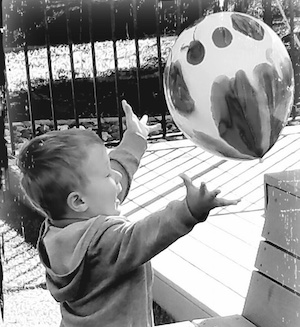 Child playing with a ballon