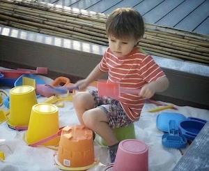 Child playing in a sandbox