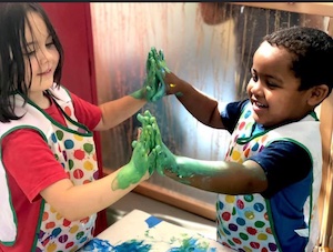 Kids playing with paint