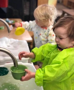 Kids playing with bubbly water